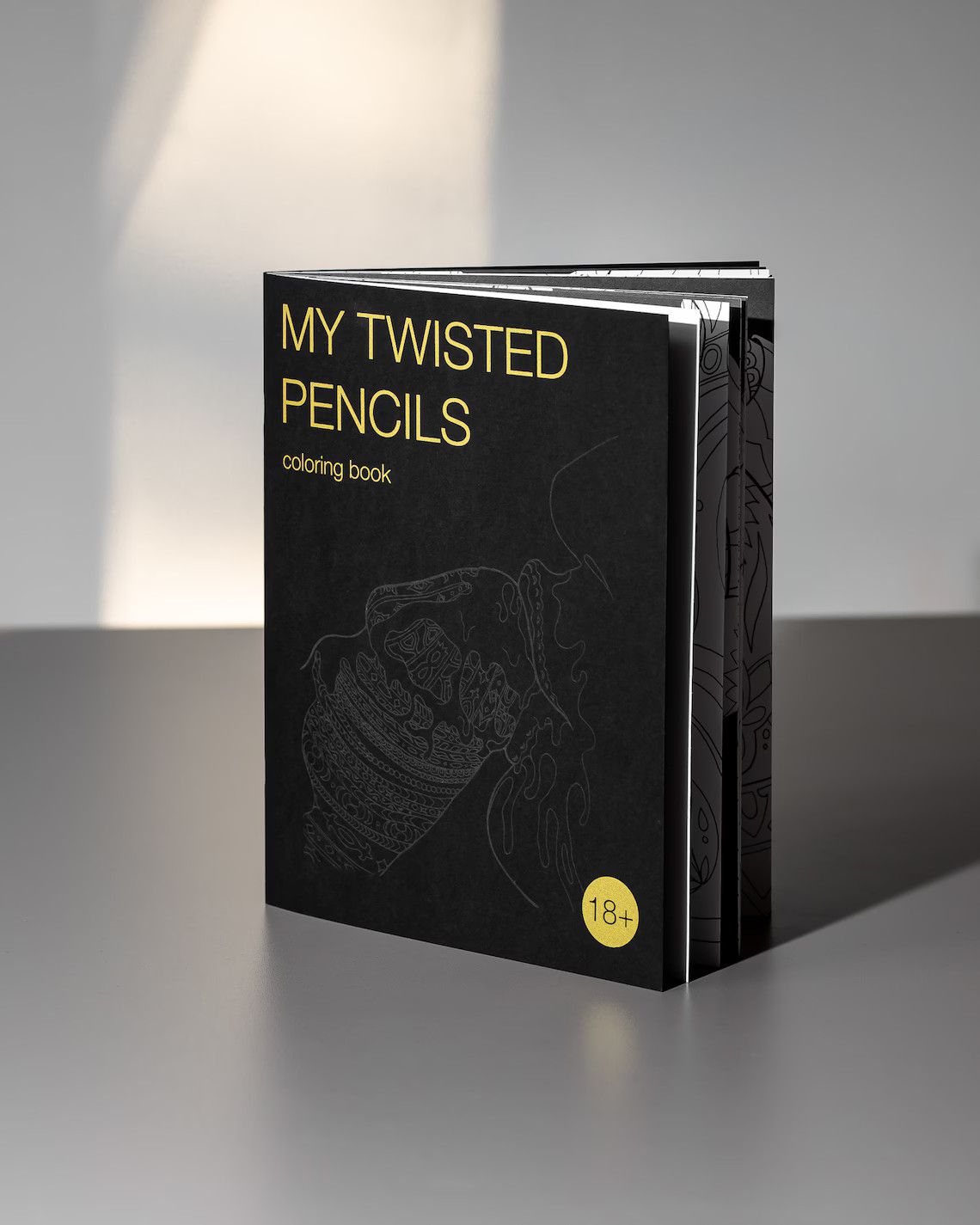 Photo of an adult coloring book featuring ornamental lineart
